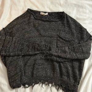 A cute over sized sweater with fringes